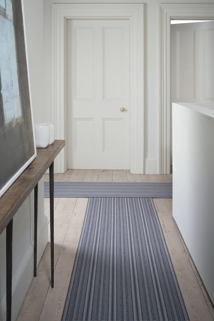 stripes Roger Oates flatweave in a hallway